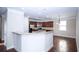 Modern kitchen featuring stainless steel appliances, granite countertops, and ample cabinet space at 3020 Whitfield Ave, Cumming, GA 30040