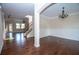 View of open floor plan showing living room and dining room areas with hardwood floors at 3020 Whitfield Ave, Cumming, GA 30040
