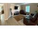 Comfortable living room with plush leather seating and modern amenities at 3020 Whitfield Ave, Cumming, GA 30040