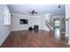 Bright living room with fireplace, hardwood floors and a staircase leading upstairs at 3020 Whitfield Ave, Cumming, GA 30040