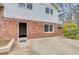 Brick house back entrance with concrete patio at 2270 Old Concord Se Dr, Covington, GA 30016