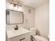 Bathroom featuring a vanity with modern light fixture, mirror, and new toilet at 2270 Old Concord Se Dr, Covington, GA 30016