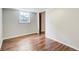Cozy bedroom with wood floors, paneled walls, and a window offering natural light at 2270 Old Concord Se Dr, Covington, GA 30016