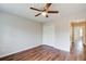 Neutral bedroom with double closet, ceiling fan, and wood floors at 2270 Old Concord Se Dr, Covington, GA 30016