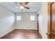 Bedroom featuring hardwood floors, a ceiling fan, and natural light from a window at 2270 Old Concord Se Dr, Covington, GA 30016