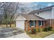 Charming home featuring a garage, driveway, and brick accents at 2270 Old Concord Se Dr, Covington, GA 30016