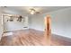 Spacious living room with wood floors leading to a dining area and stairway at 2270 Old Concord Se Dr, Covington, GA 30016