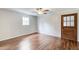 Room featuring hardwood floors, panelling, a window, and glass-paneled door at 2270 Old Concord Se Dr, Covington, GA 30016