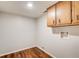 Room featuring hardwood floors and a cabinet mounted on the wall at 2270 Old Concord Se Dr, Covington, GA 30016