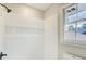 Shower stall showcasing the tiled walls, shower niche, and matte black fixtures at 2270 Old Concord Se Dr, Covington, GA 30016