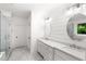 Modern bathroom with double vanity, marble countertops, shiplap accent wall, and glass-enclosed shower at 281 Green Hill Rd, Atlanta, GA 30342