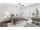 Well-lit bedroom with hardwood floors, a ceiling fan, and plantation shutters for a cozy feel at 281 Green Hill Rd, Atlanta, GA 30342