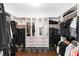 Organized walk-in closet with ample storage, mirrored cabinets, and stylish shelving for clothes and accessories at 281 Green Hill Rd, Atlanta, GA 30342