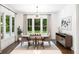 Elegant dining room with large windows offering views of the landscaped backyard at 281 Green Hill Rd, Atlanta, GA 30342
