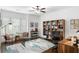 Inviting home office space with natural light, a ceiling fan, and built-in wooden shelving at 281 Green Hill Rd, Atlanta, GA 30342