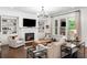 Inviting living space featuring a cozy fireplace, built-in bookshelves, and elegant furnishings at 281 Green Hill Rd, Atlanta, GA 30342