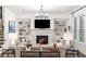 Bright living room with fireplace, built-in shelving, and large windows offering natural light at 281 Green Hill Rd, Atlanta, GA 30342