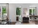 View from the living room to a patio with outdoor seating and dining room at 281 Green Hill Rd, Atlanta, GA 30342