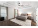 Spacious main bedroom with a tray ceiling, neutral decor, and large windows at 281 Green Hill Rd, Atlanta, GA 30342