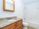 Bathroom features a vanity with granite countertop, a tub and tile flooring at 1201 Old Hammond, Atlanta, GA 30350