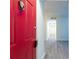 Inviting entryway featuring new grey flooring and a bright red door at 1201 Old Hammond, Atlanta, GA 30350