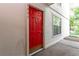 Image of a striking red front door with modern hardware and house numbers at 1201 Old Hammond, Atlanta, GA 30350