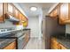 Well-equipped kitchen with stainless steel appliances and light wood cabinetry at 1201 Old Hammond, Atlanta, GA 30350