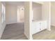 An open floor plan with built-in cabinets and new luxury vinyl plank flooring at 1201 Old Hammond, Atlanta, GA 30350