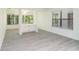 Spacious living room with built-in cabinets, lots of light and new LVP flooring at 1201 Old Hammond, Atlanta, GA 30350