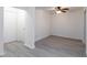 A bright room with new grey flooring, ceiling fan and freshly painted walls at 1201 Old Hammond, Atlanta, GA 30350