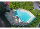 Aerial view of the pristine community pool, surrounded by lush greenery and lounge chairs at 1201 Old Hammond, Atlanta, GA 30350