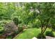 Lush backyard features mature trees and landscaping at 2314 Tall Timbers Ln, Marietta, GA 30066