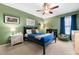 Cozy bedroom with carpeted floors, ample light, and a ceiling fan at 2314 Tall Timbers Ln, Marietta, GA 30066