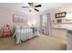 Charming bedroom featuring carpeted floors, ample light, and decorative touches at 2314 Tall Timbers Ln, Marietta, GA 30066
