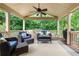 Covered patio features seating and wooded views at 2314 Tall Timbers Ln, Marietta, GA 30066