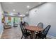 Open-concept dining and living area with wood floors and modern furnishings at 2314 Tall Timbers Ln, Marietta, GA 30066