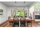 Bright dining room features a fireplace and french doors leading to an outdoor patio at 2314 Tall Timbers Ln, Marietta, GA 30066