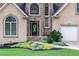 Close-up of the home's front entrance, featuring a stone walkway and beautiful landscaping at 2314 Tall Timbers Ln, Marietta, GA 30066