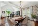 A spacious living area with hardwood floors, piano, and a dining table and chairs at 2314 Tall Timbers Ln, Marietta, GA 30066