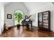 Elegant living room with a grand piano, hardwood floors, and lots of natural light at 2314 Tall Timbers Ln, Marietta, GA 30066