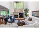 Well-lit living room with fireplace, large windows, and comfortable seating at 2314 Tall Timbers Ln, Marietta, GA 30066
