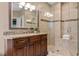 Updated bathroom featuring a granite vanity, a walk-in shower, and plenty of natural light at 2314 Tall Timbers Ln, Marietta, GA 30066