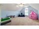Spacious room with blue walls, arched window, carpeted floor, and play tent at 2314 Tall Timbers Ln, Marietta, GA 30066
