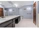 Large bathroom with double sinks, a long vanity and storage, and separate shower at 2371 Leguin Mill Rd, Locust Grove, GA 30248