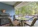 Wooden deck with stainless steel grill and table with chairs at 2371 Leguin Mill Rd, Locust Grove, GA 30248