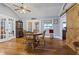 Dining room with hardwood floors, french doors to the sunroom, and barn door accent at 2371 Leguin Mill Rd, Locust Grove, GA 30248
