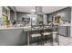 Kitchen with granite countertops, stainless steel appliances, breakfast bar, and ample cabinet space at 2371 Leguin Mill Rd, Locust Grove, GA 30248