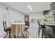 Bright kitchen with breakfast table perfect for casual dining near granite countertop and stainless appliances at 2371 Leguin Mill Rd, Locust Grove, GA 30248
