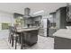 Modern kitchen with granite countertops, stainless steel appliances, and a stylish center island at 2371 Leguin Mill Rd, Locust Grove, GA 30248