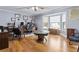 Spacious office with hardwood floors, bay windows, and custom wood table feature at 2371 Leguin Mill Rd, Locust Grove, GA 30248